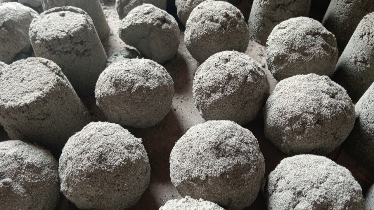 Brand new video of super soft and super dusty balls and shapes of fine black sand crumbling on floor