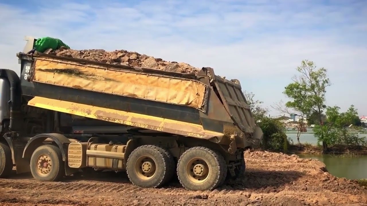 New Cat 972K Wheel Loader Loading Soil On Trucks - 4k Drone Footage - Sotiriadis/Labrianidis