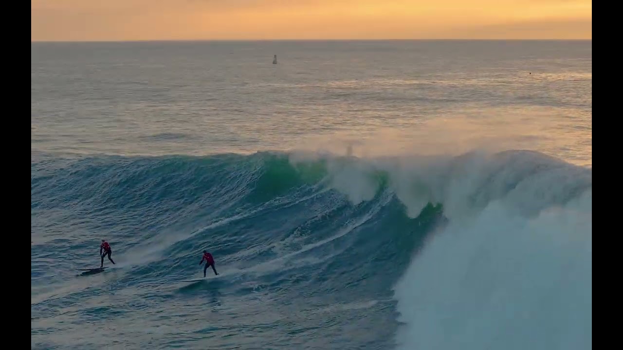 Surfers Ride Massive Waves at Half Moon Bay