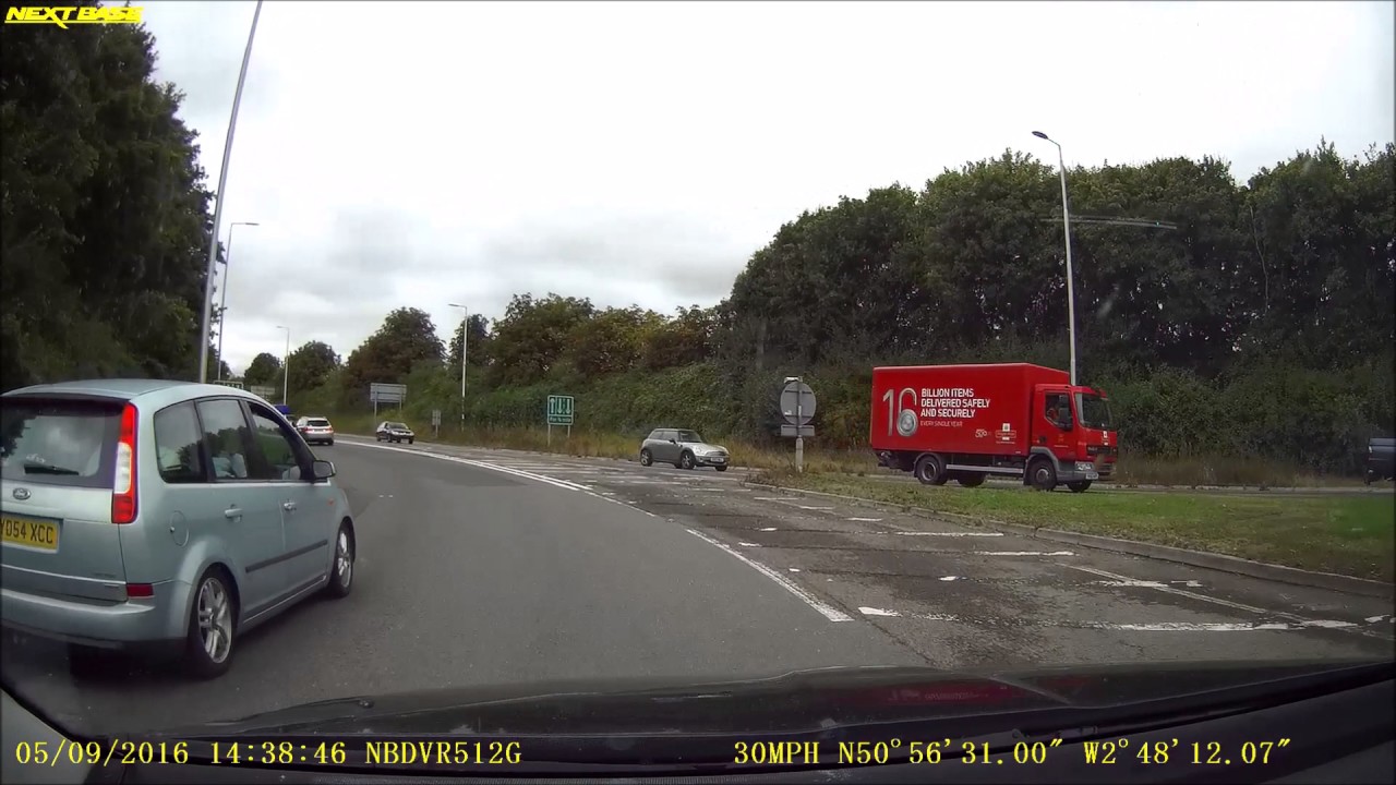 YD54 XCC Takes left lane for 3rd exit and then STOPS on exit nearly causing an accident