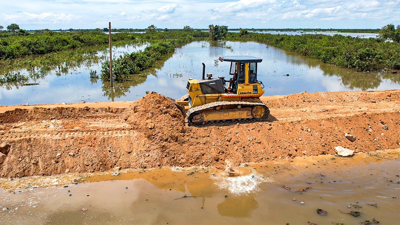 Outstanding Work of Operator Bulldozer Technique Landfilling Up Roadside Pushing the Earth