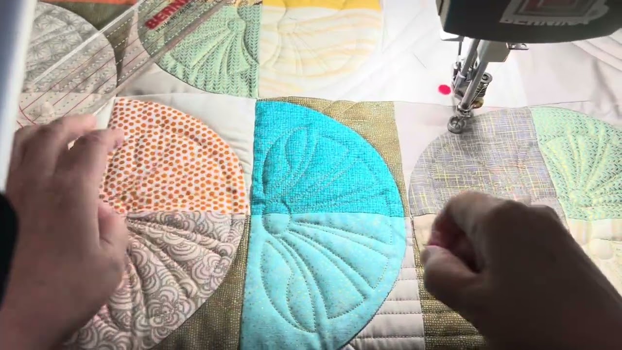A modern quilting scheme comprises straight lines and digital motifs
