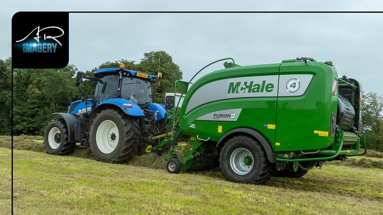 New Holland T7.210 on the McHale Fusion 4 baling grass