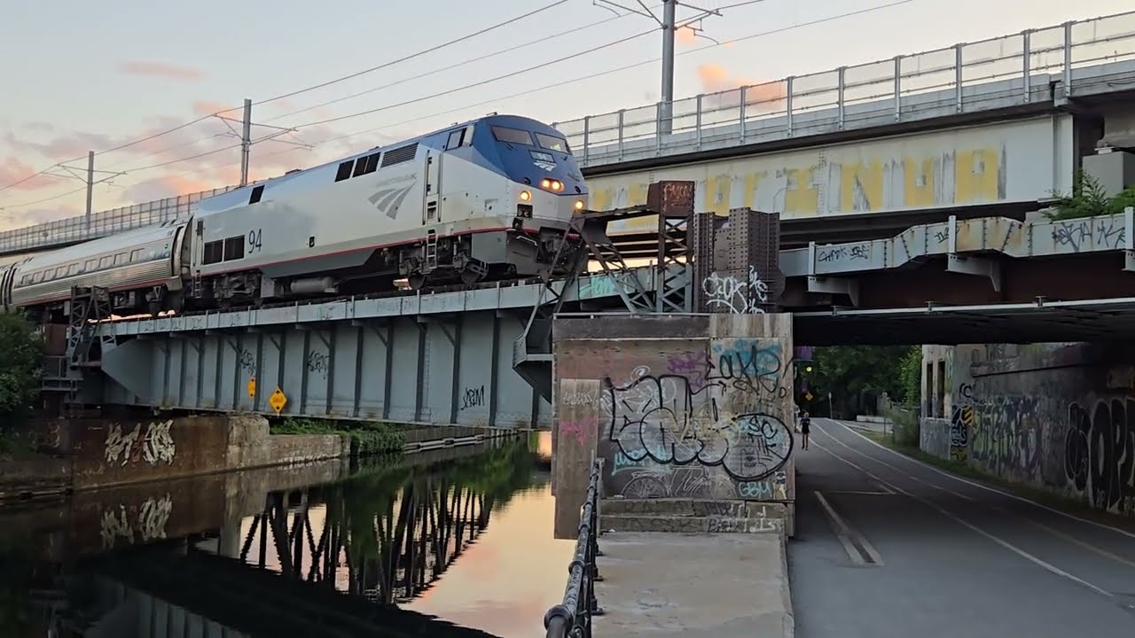 MANY TRAINS  EXO Via and Amtrak at Peel Basin in Griffintown Near Sunset