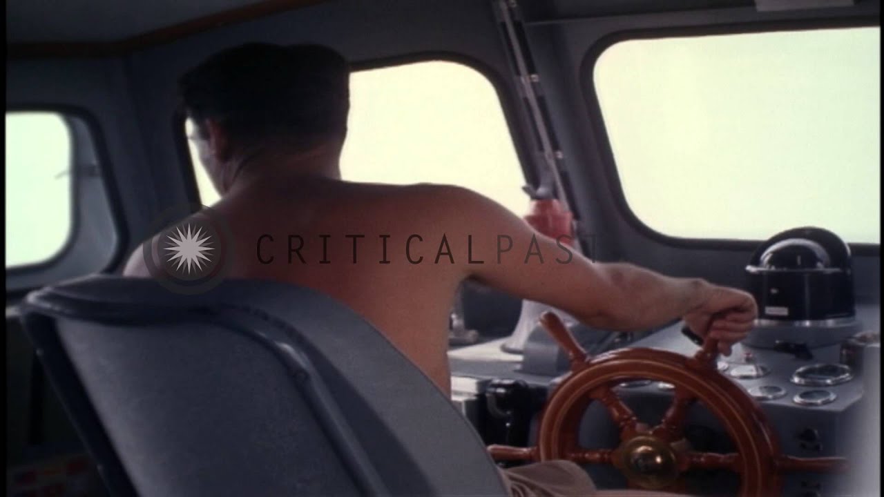 J H Rhodes cleans and applies grease to the barrel of a .50 Caliber Machine Gun a...HD Stock Footage