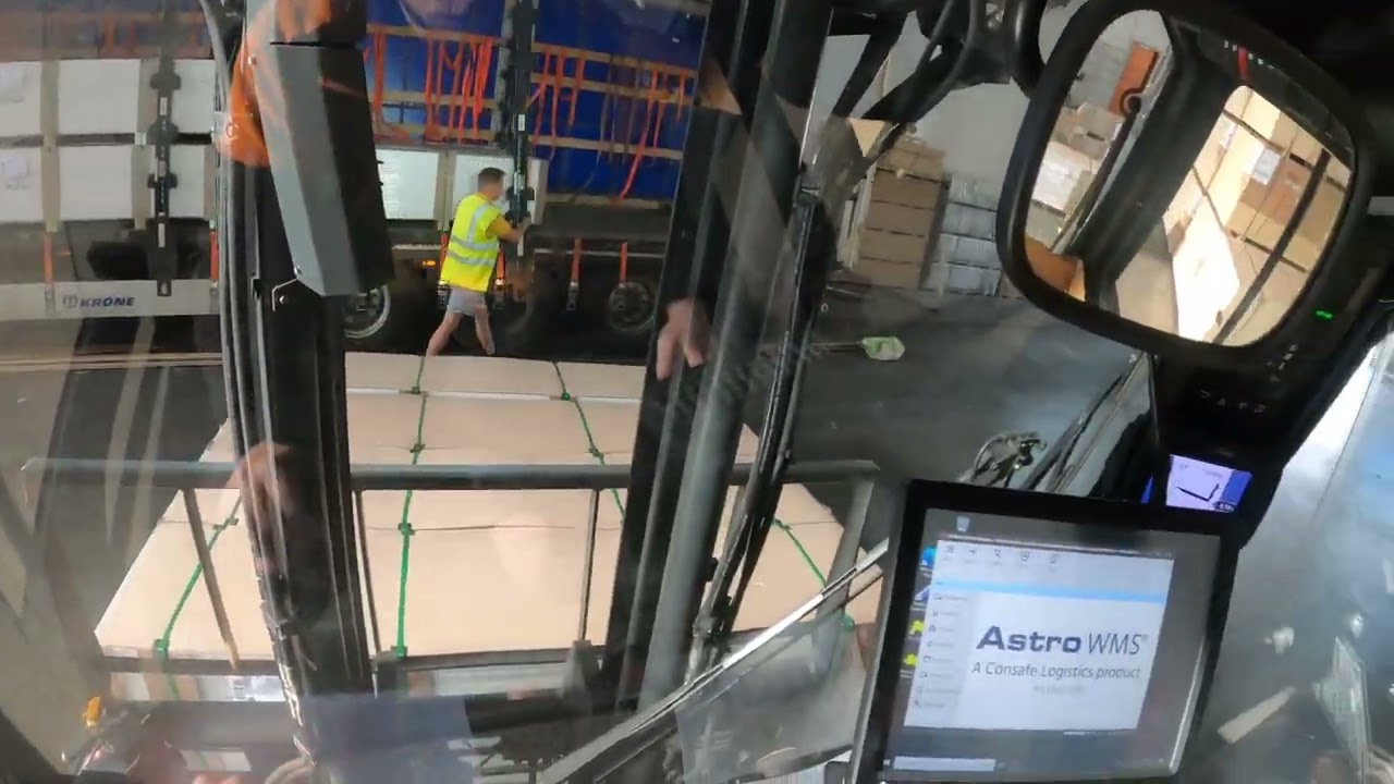 5-ton forklift POV! Unloading full trailer with melamine shelf