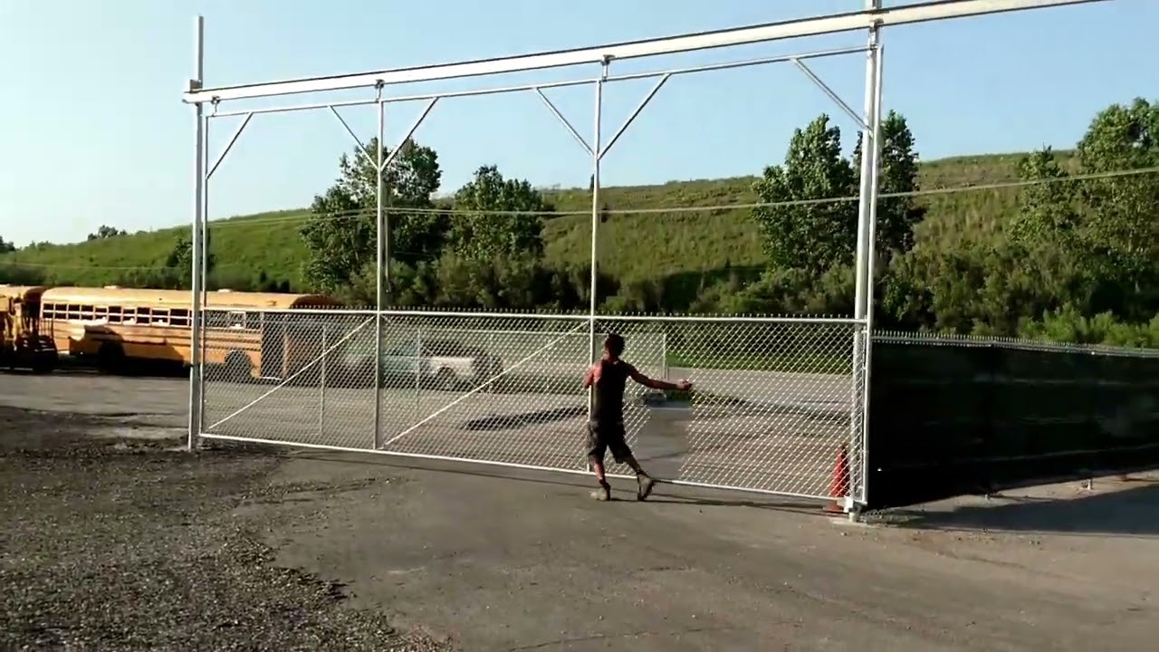 30 foot slide gate on overhead i beam by American Fence Professionals, Inc