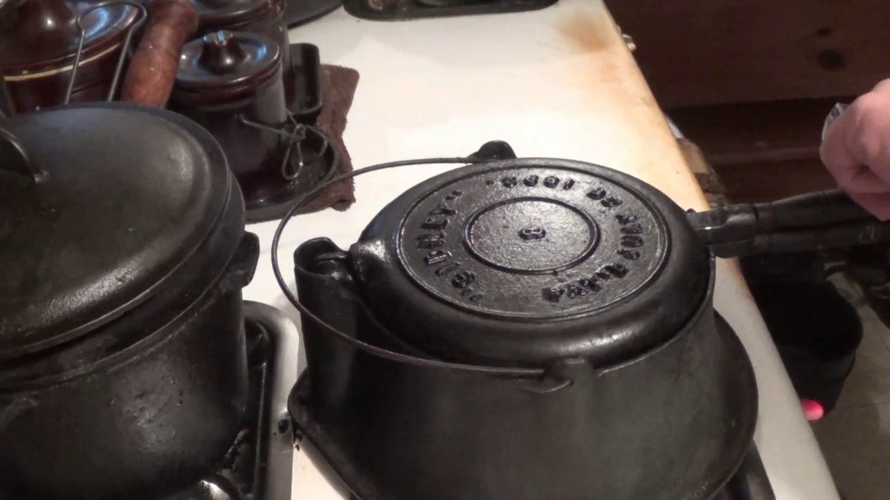 Making waffles in an antique cast iron waffle iron