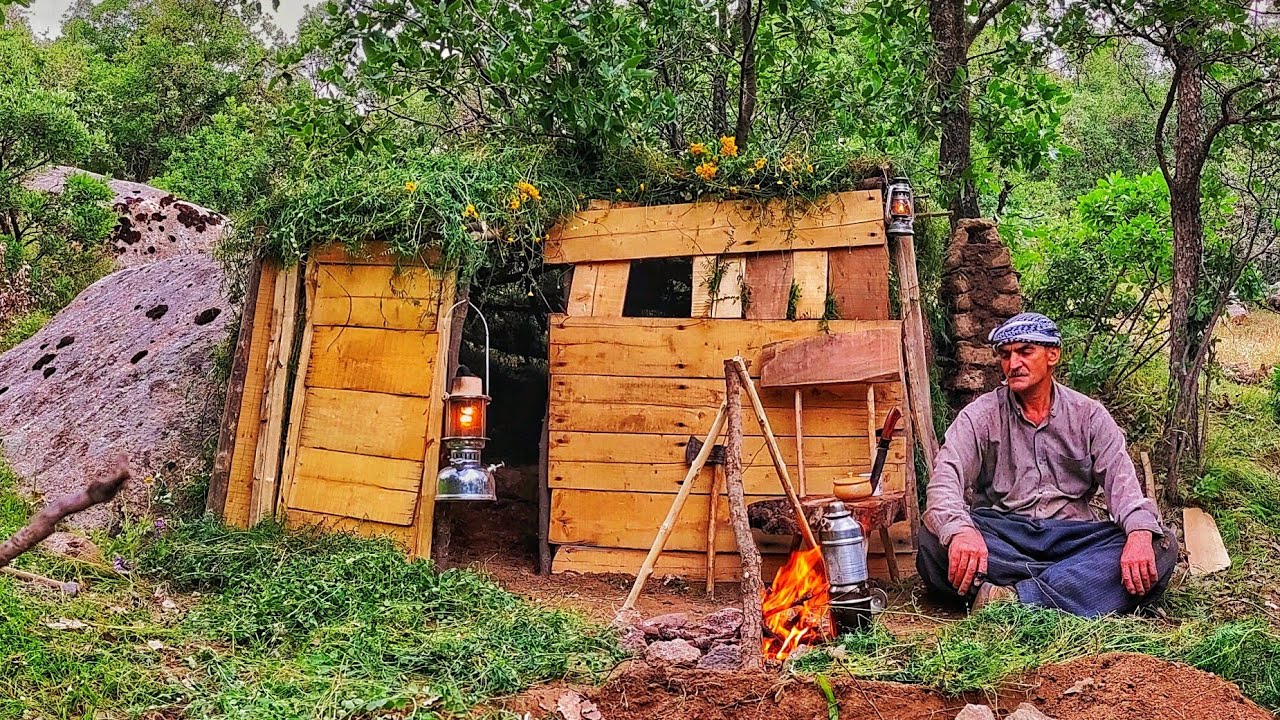 Tiny and Cozy: Building a Charming Wooden Shelter next to the Rocks