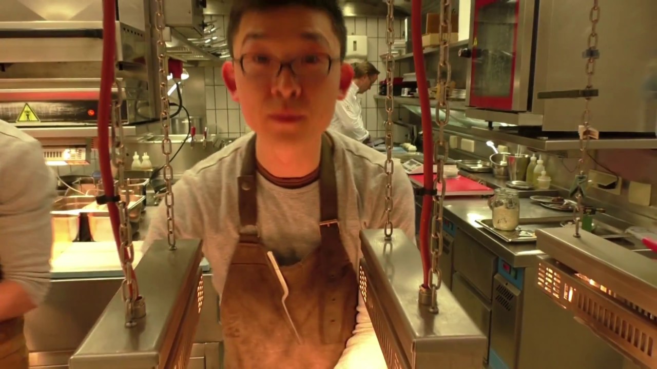 Jung prepares a crayfish truffle dish at the 3 Michelin star La Vie