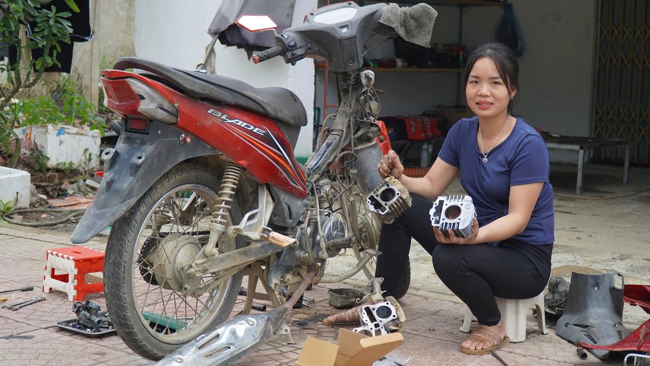 Talented bike repair girl: replacing combustion chamber and piston for 109cc motorbike