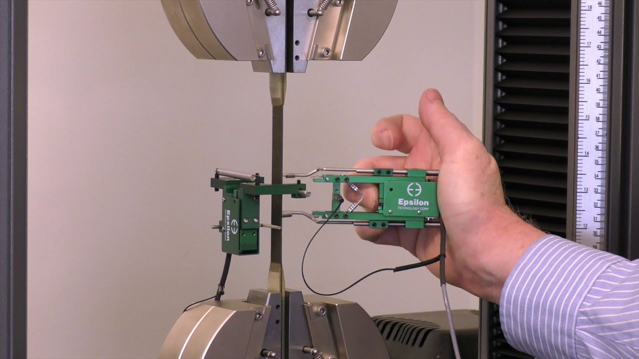 Transverse extensometer installation on a composite specimen to measure Poisson’s ratio (Model 3575)