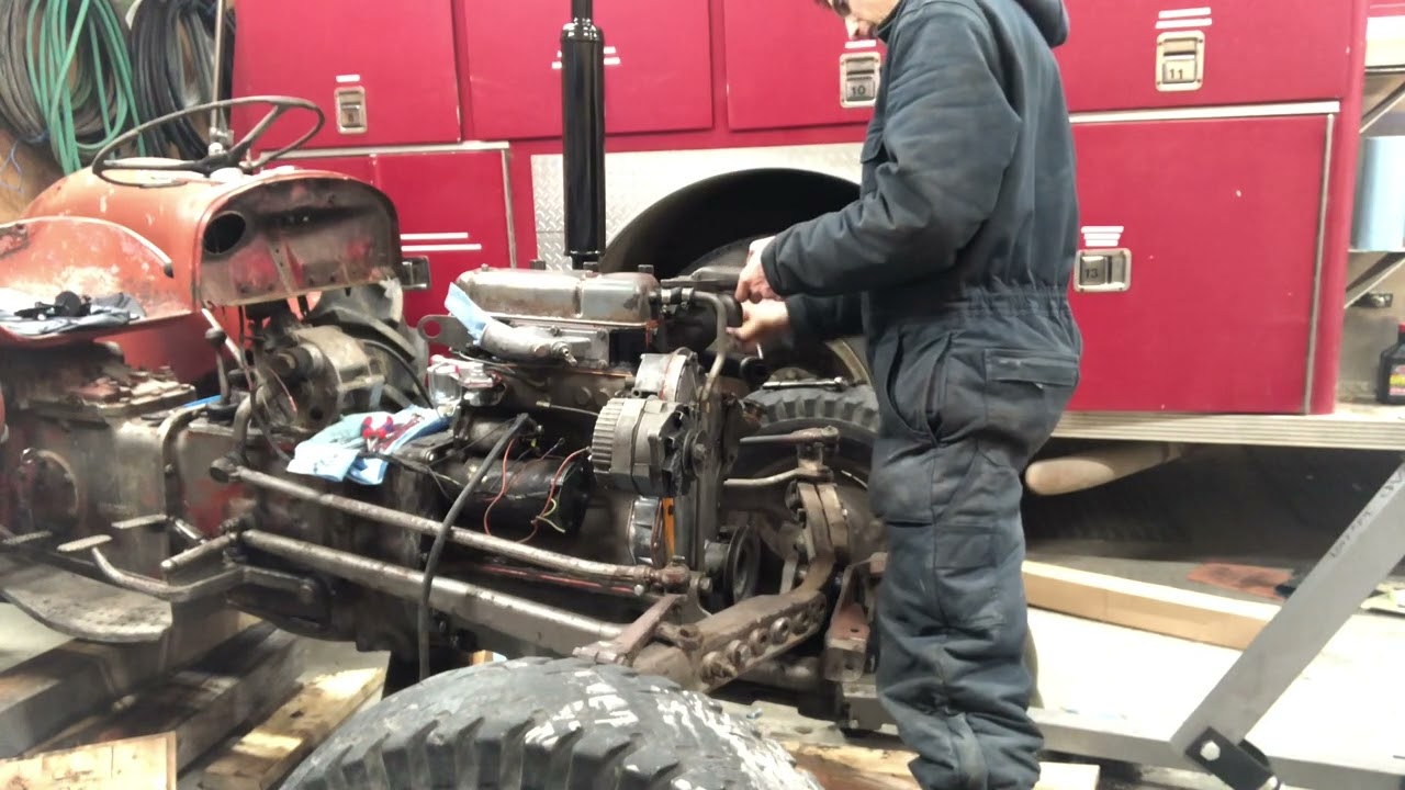 Bolting on the thermostat housing on my massey ferguson 35, 3 cylinder perkins diesel