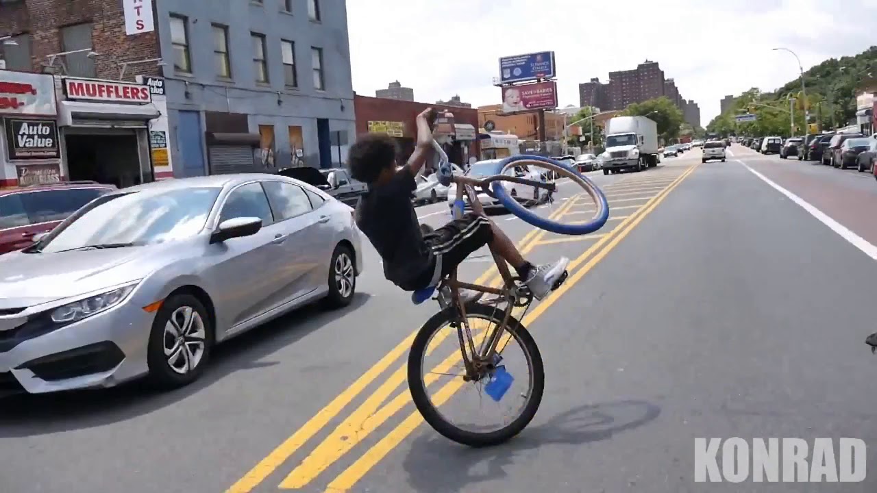 Young Buffalo Weelie Bicycle On The Street