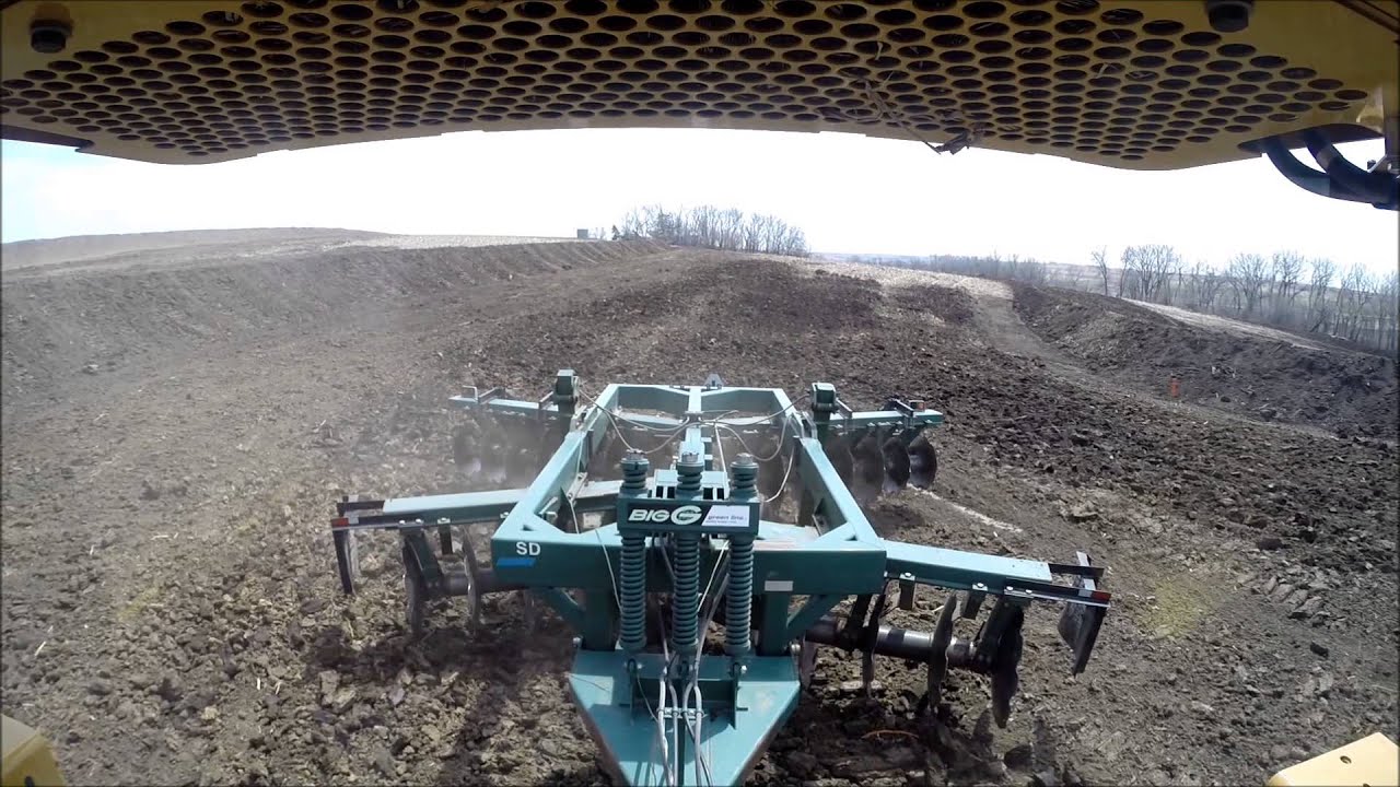CAT D8T pulling Big G Disc