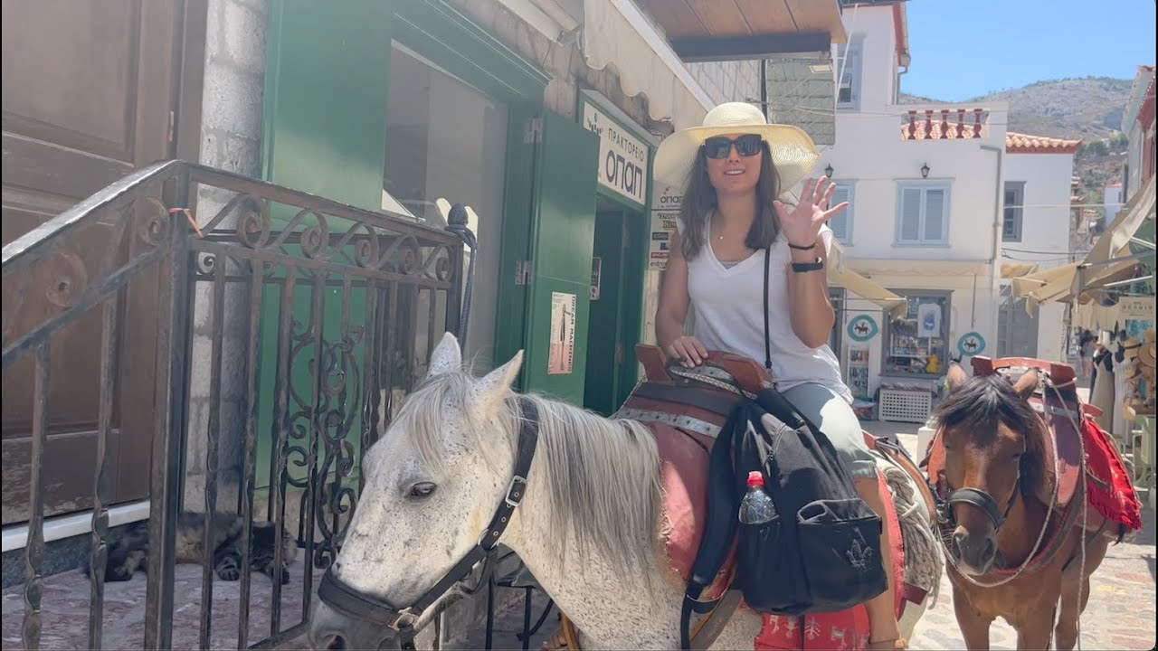 Glamorous Sonia Rides a Donkey in Hydra Island
