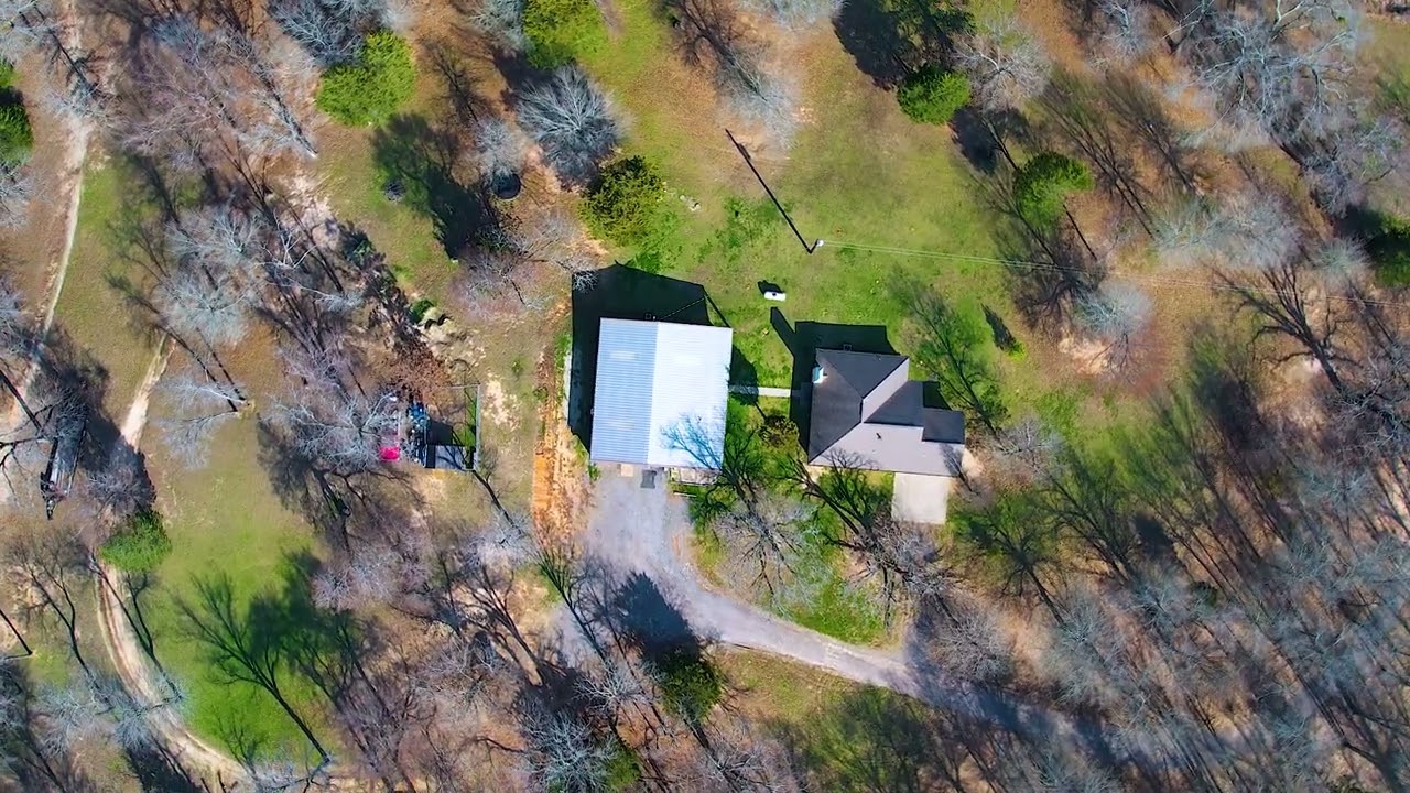 10 acres, a huge shop, and 2 separate living quarters!