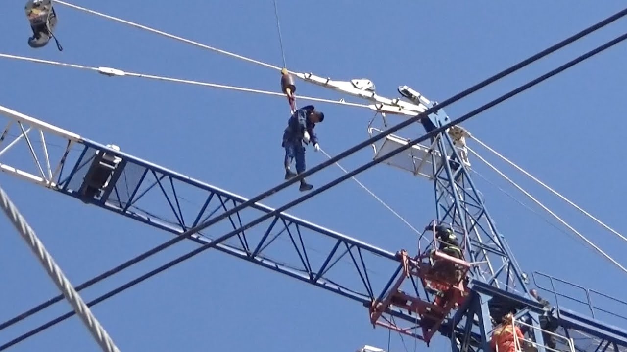 Firefighters rescue unconscious worker trapped on tower crane