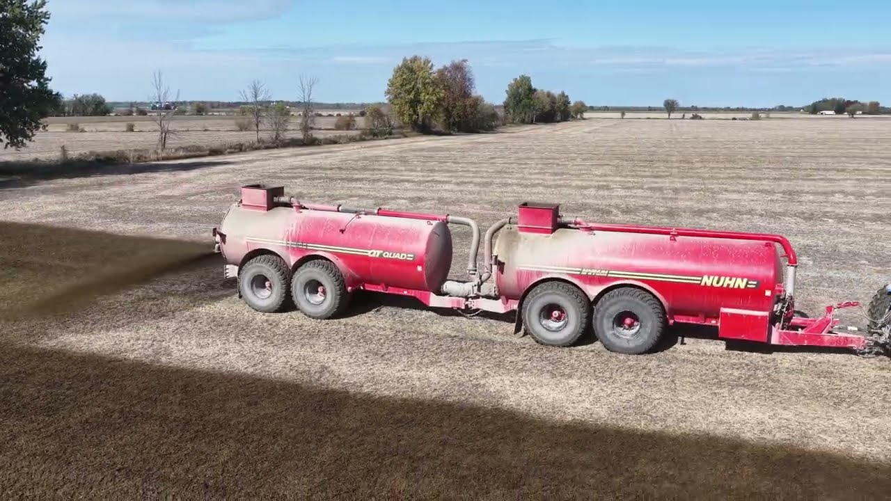 CANADIAN FARMER - SLINGING NEUTRIENT RICH MANURE ON THE FIELDS . Nuhn Quad Trac tankers to the task.