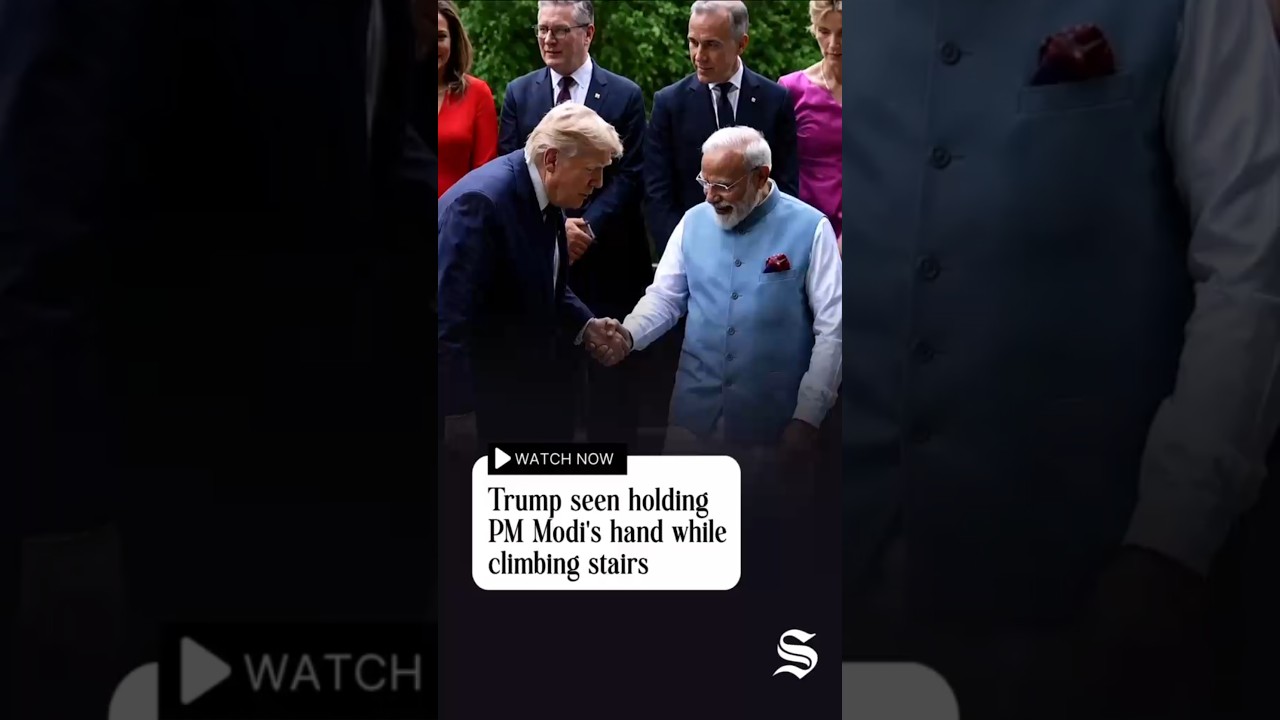 Trump seen holding PM Modi's hand while climbing stairs