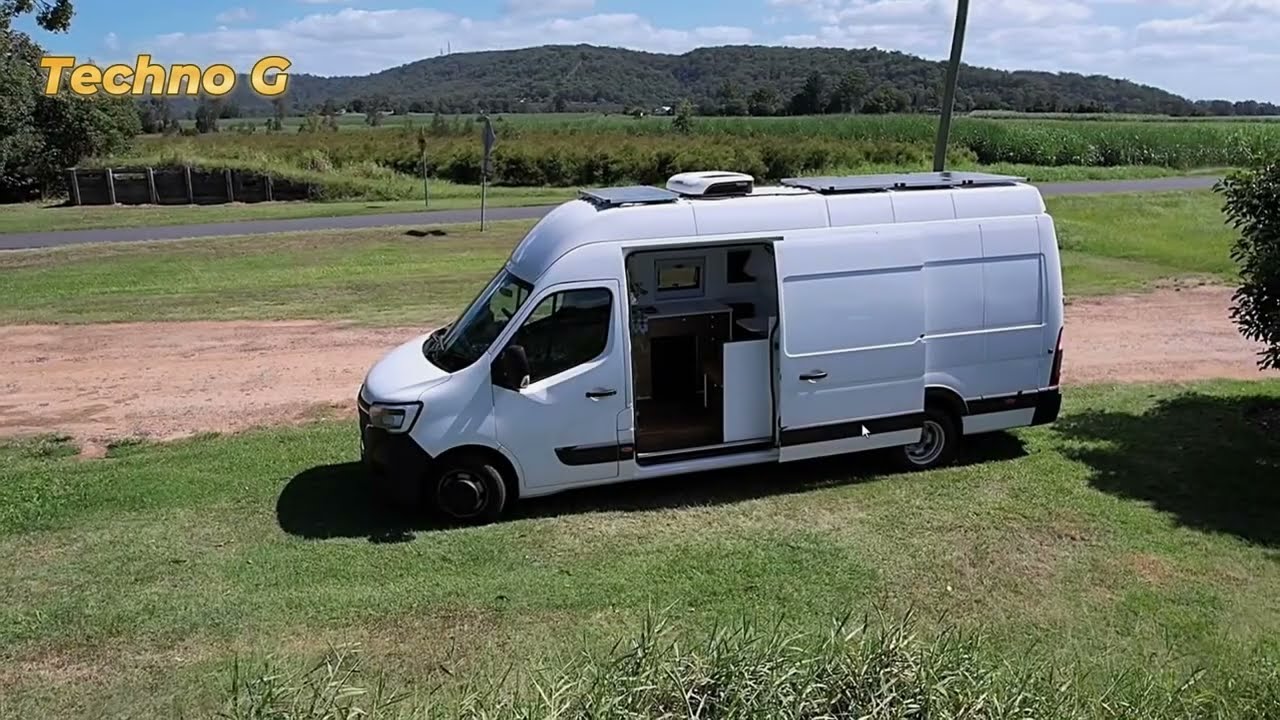 Stealthy Motorcycle Camper Van: Snug Living Space & Massive Garage!