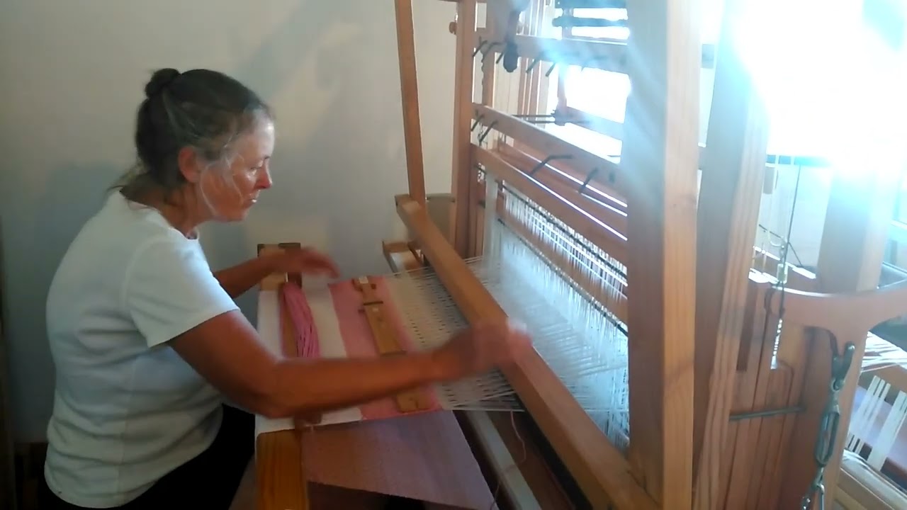 WEAVING ON A MECHANICAL DOBBY LOOM MADE BY JOHN WALLACE