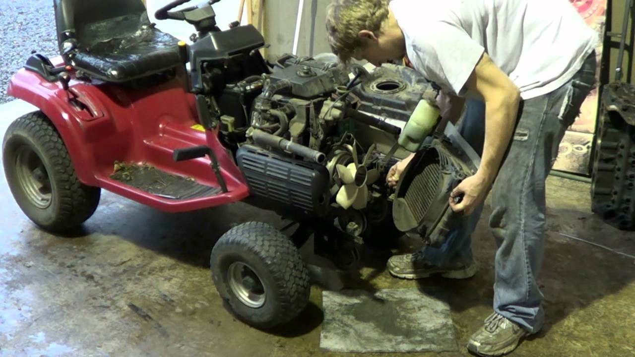 Working on the Honda tractor's pto clutch