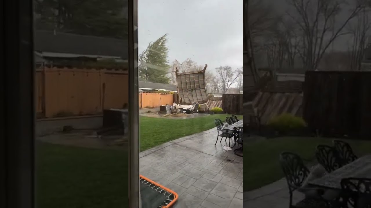 Gazebo Gets Picked Up by Wind and Collides Into Fence - 1396188
