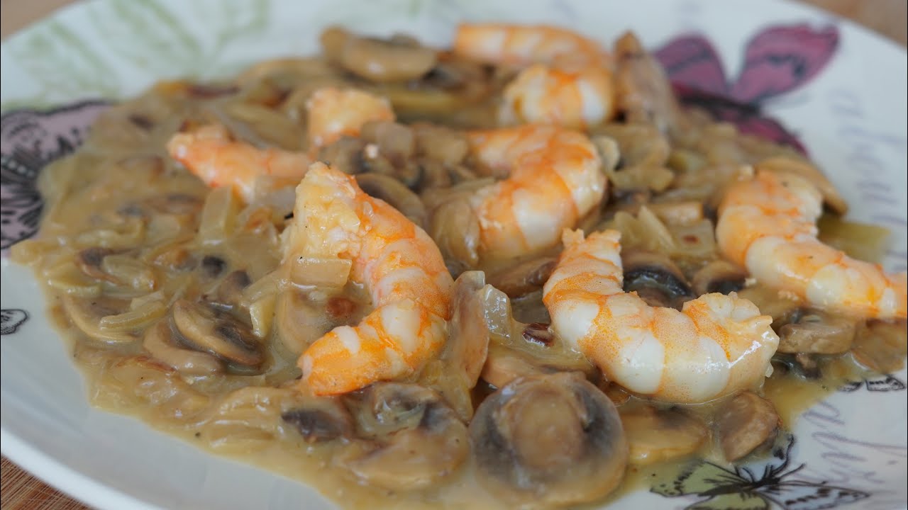 Champiñones en salsa con langostinos