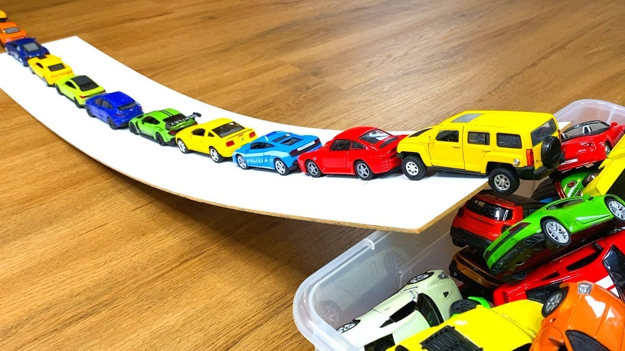 Various Bigger and Smaller Diecast Model Cars Moving Down On Slider #12