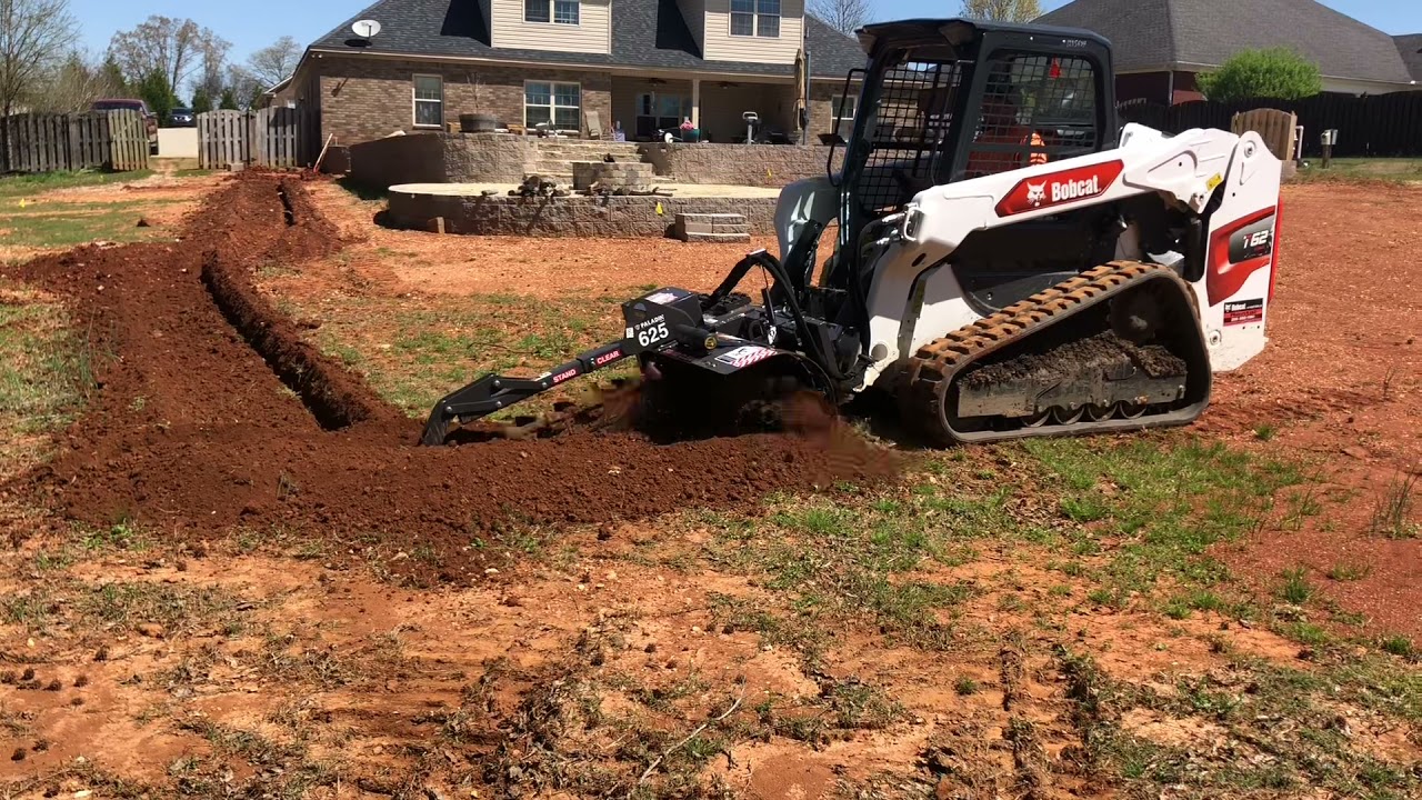 Bobcat T62 with Bradco 625 trenching for a irrigation system