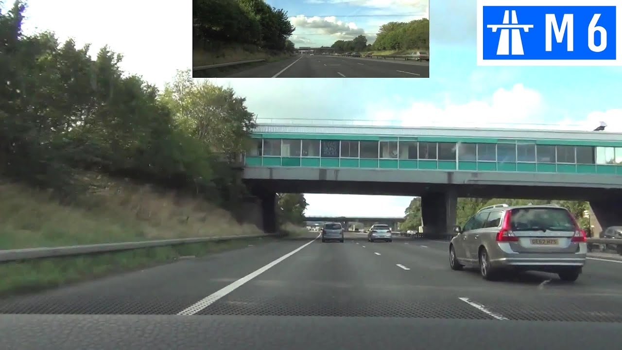Driving in the UK - M6 Motorway - J17 to J19 - Front View with Rearview Mirror