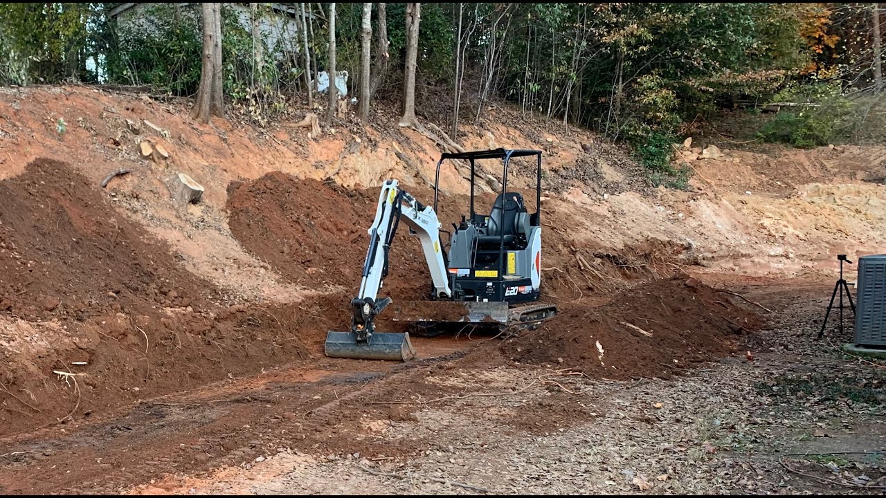 Bobcat Excavator Digging Out for Retaining Wall