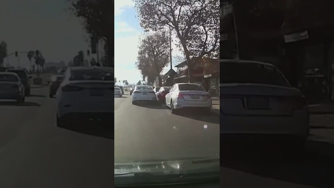 Car hits mirror of parked car.