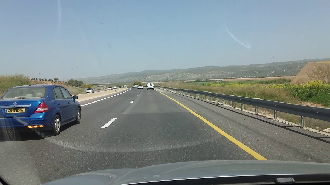 Driving on Highway 2 in Israel with view of Carmel Mountain.