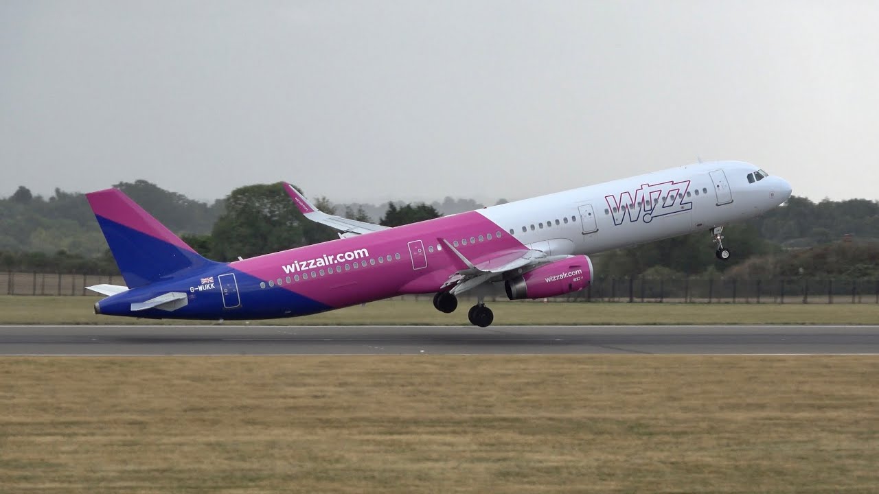 A Windy afternoon at London Luton Airport. Plane spotting in 4K