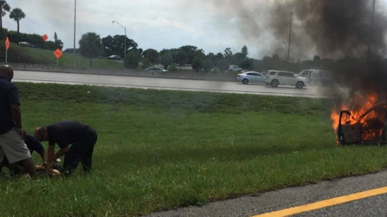 Tow truck driver saves man from burning car