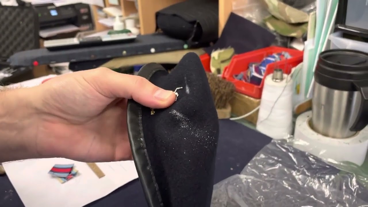 Fixing Royal Signals beret badge to a beret