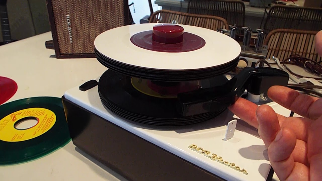 RCA 45-J2 record changer playing a stack of records.