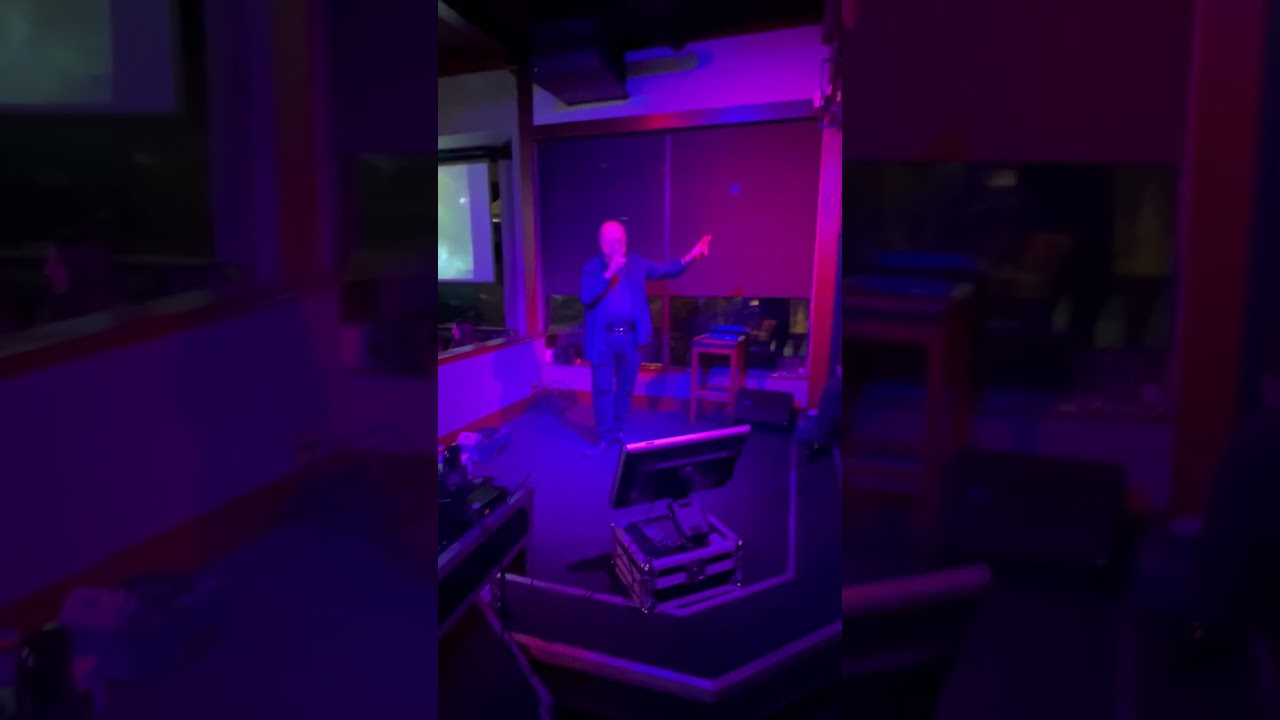 Singing Sweet Caroline at the John B pub during a packed house due to a singing competition.