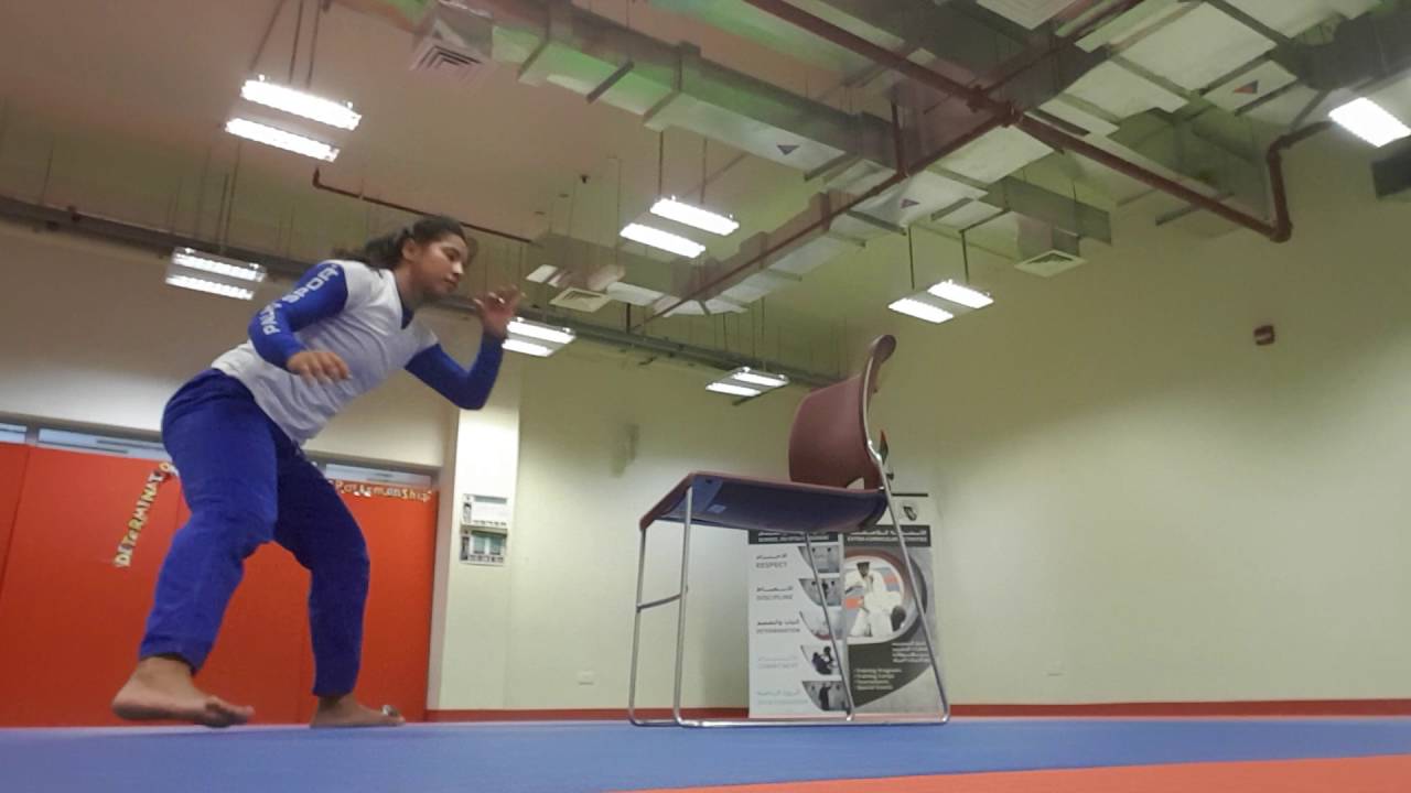 Capoeira training with a chair