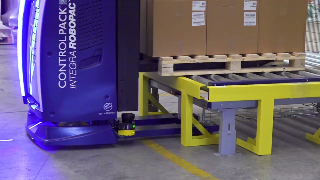 #PREMONTAJE | Línea automática de flejado y envoltura alimentada mediante vehículo automático LGV