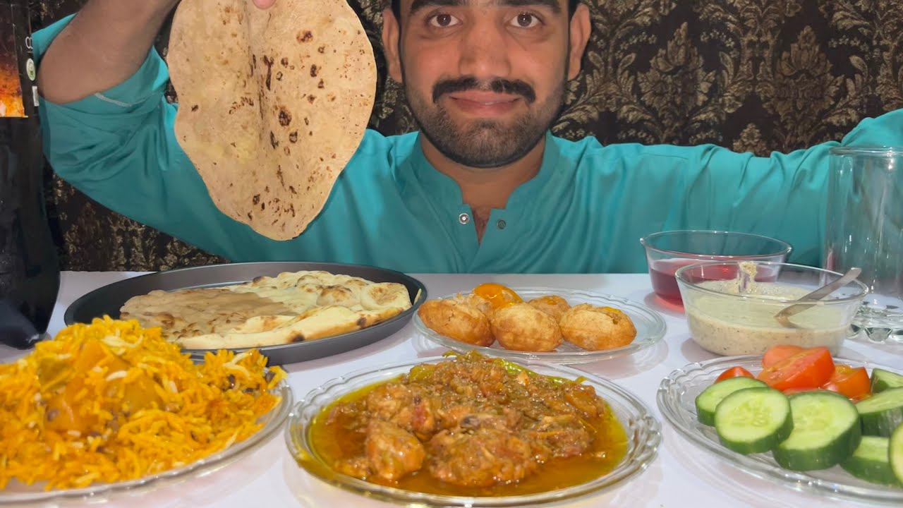 Chicken kari roti chicken biryani with pani puri cold drink and raita salad 