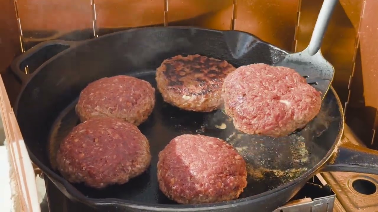 Cooking burgers and fries during camping experimental shots