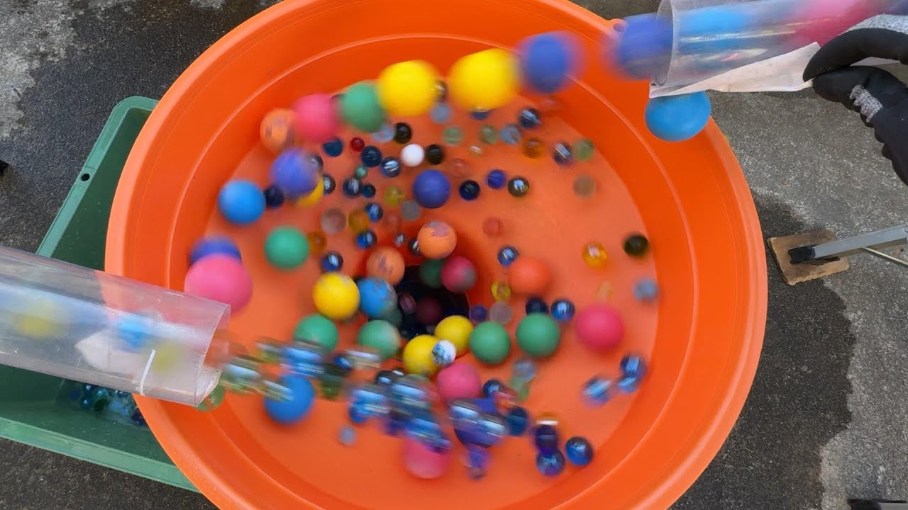 Make a water marble run course using two transparent pipes, a large funnel and an aquarium.  #ASMR