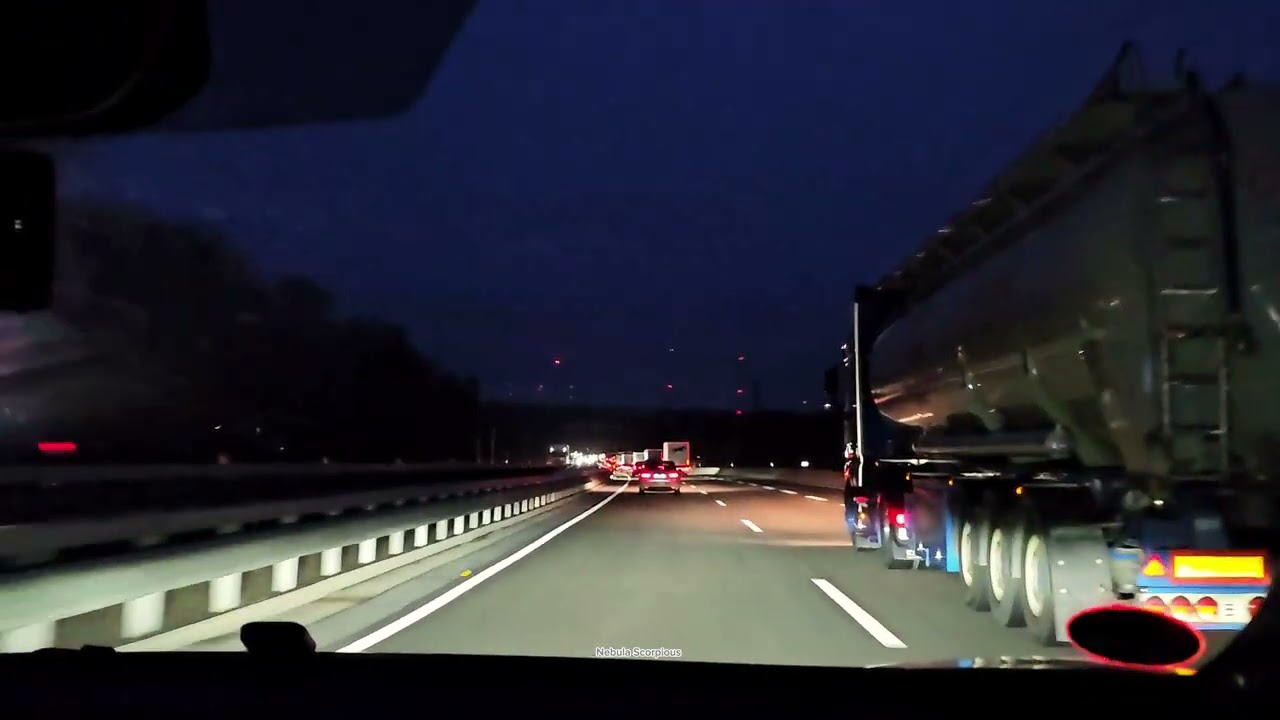 Moderate Traffic Flow On The Autobahn In Germany At Night