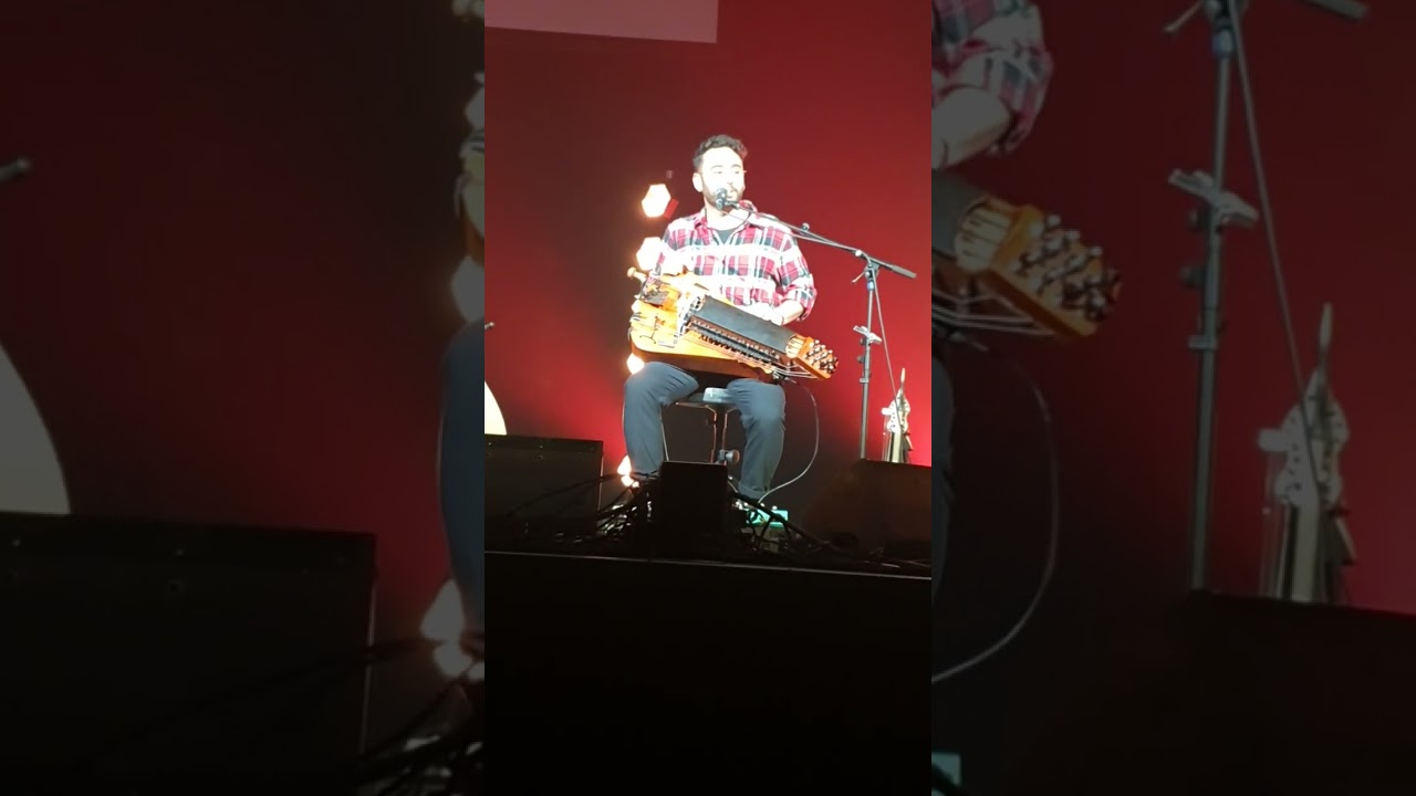 Yaron Cherniak - explaining the instrument the Hurdy Gurdy, and sings a song
