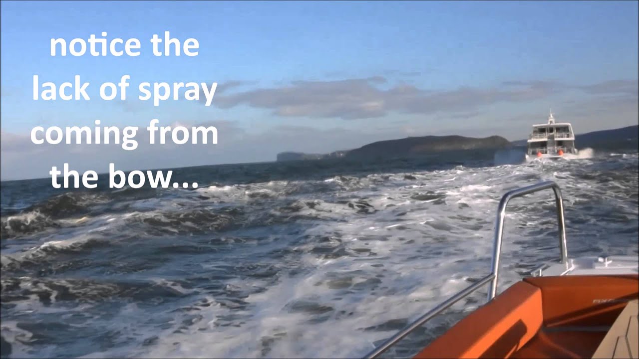 Axopar 28 T-Top cruising through rough water