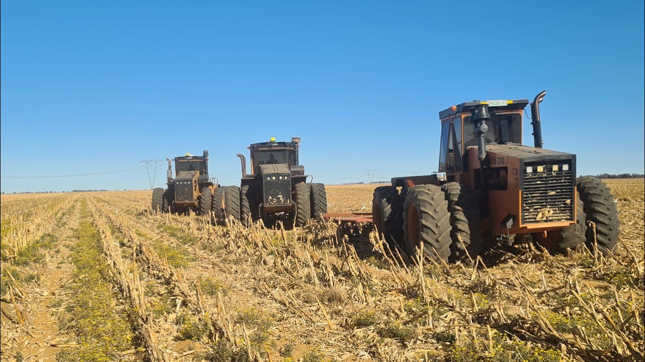 ACO 270 + 2 x ACO 350 tractors tilling field side by side near Hoopstad in South Africa