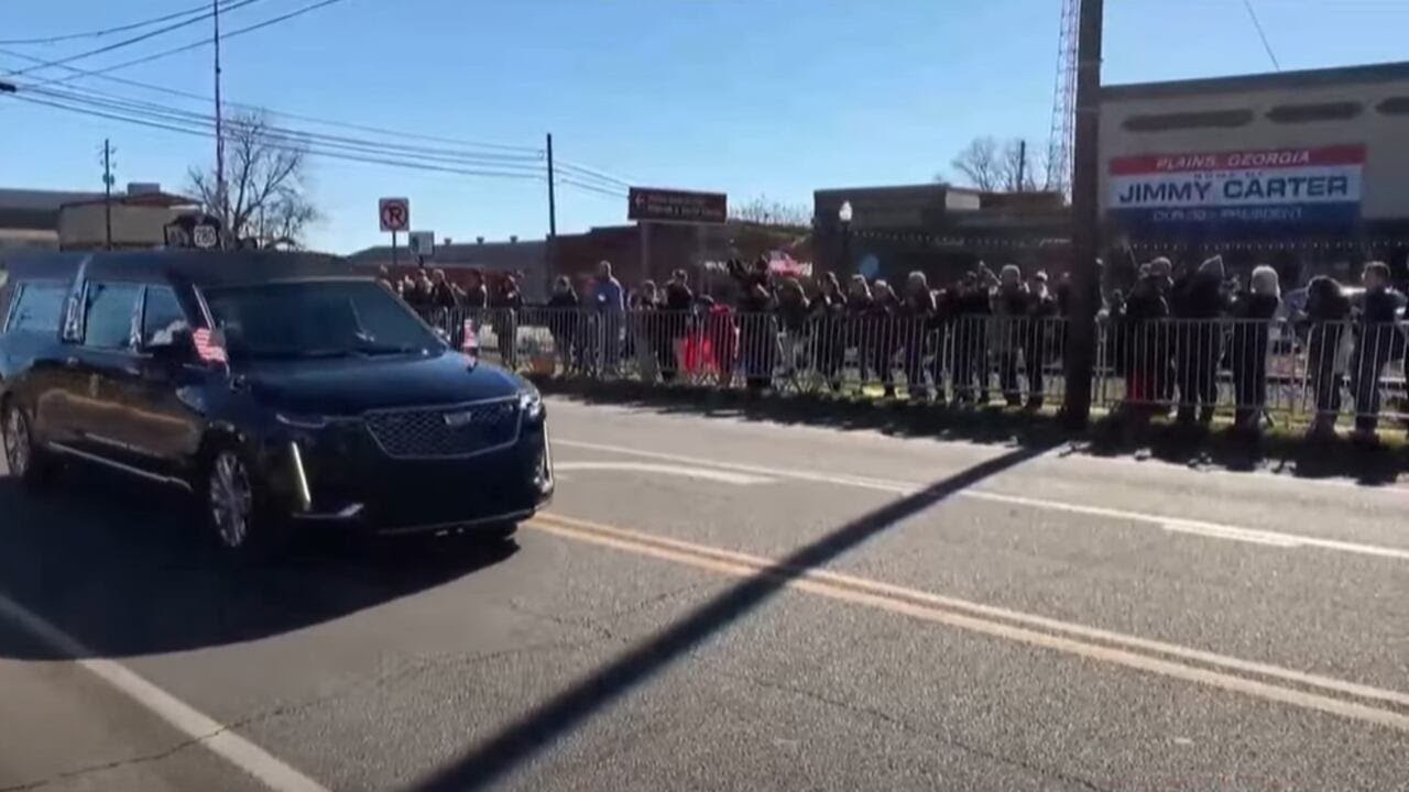 Motorcade for late former President Jimmy Carter passes through Plains